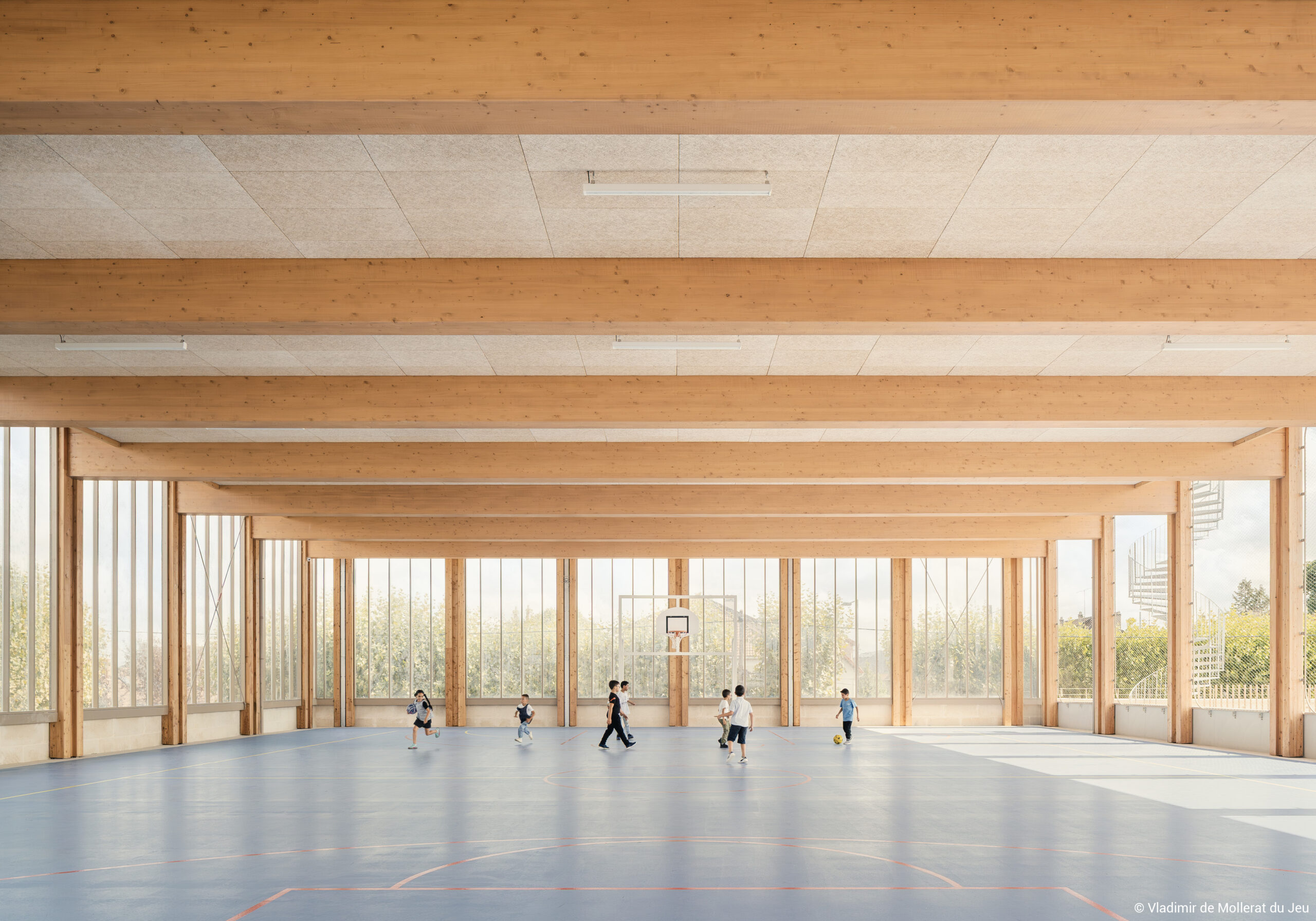 Groupe scolaire structure en bois lamellé collé, pierre et terre crue
